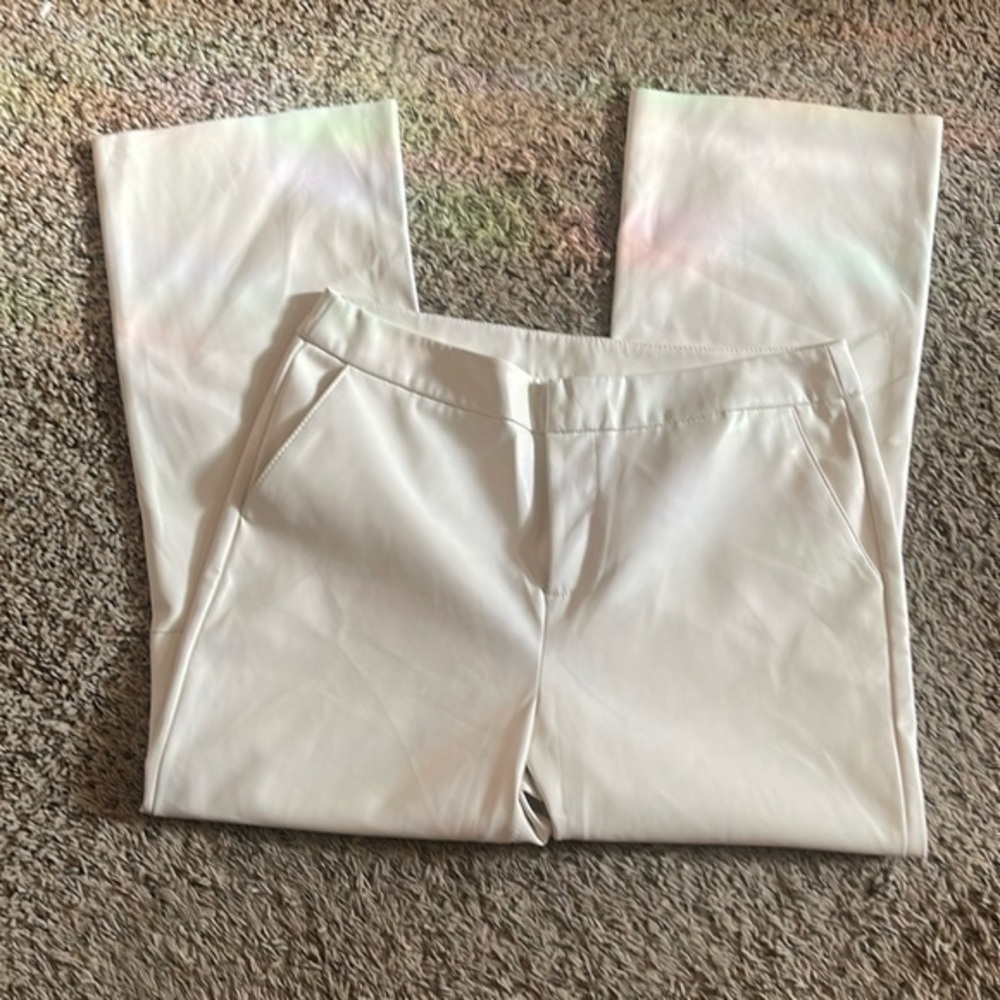 Faux leather women new dress pants with some flaws by zipper on right upper leg